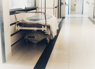 empty bed in the hospital corridor