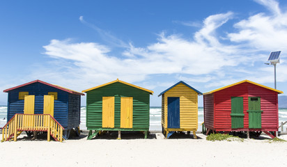 Fototapeta na wymiar Colorful huts/ houses along the beach in Muizenberg, South Africa, Africa