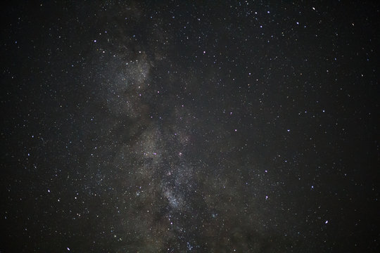 Milky way galaxy with stars and space dust in the universe, Long exposure photograph, with grain.