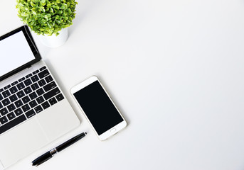 Office table with Laptop,smartphone,pen and cactus, copy space,Top view, flat lay