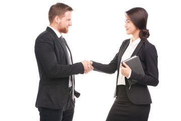 Portrait of Caucasian businessman and Asian businesswoman cooperating