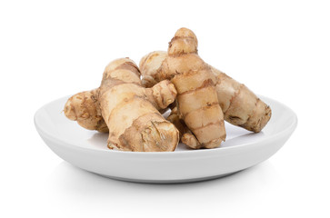 fresh turmeric  in plate on white background