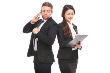 Portrait of Caucasian businessman and Asian businesswoman cooperating