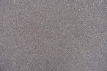 Texture of light grey asphalt from above