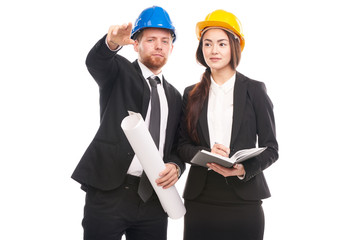 Portrait of male and female engineers wearing hardhats