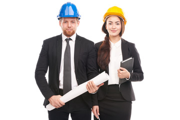 Portrait of male and female engineers wearing hardhats