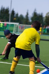 Kids playing field hockey