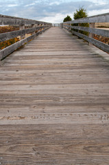 Wooden boardwalk leading toward the ocean