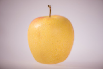 yellow apple on white background