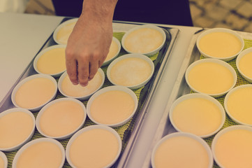 Custard making process, delicious decorated light table background, close up view