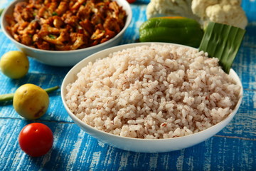 Homemade food concept- cooked red rice and vegan curry roast