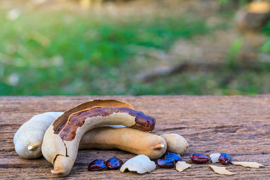 Tamarind  on wooden background.