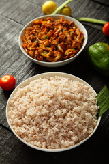 Top view - Delicious cooked red rice with vegetarian curry 