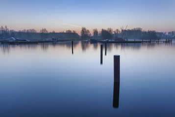 A cold and quiet harbor during sunrise