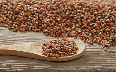 buckwheat groats and wooden spoon