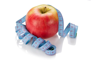 blue measure tape and red apple  isolated