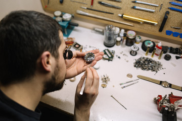Close up of watchmaker repair mechanical watch