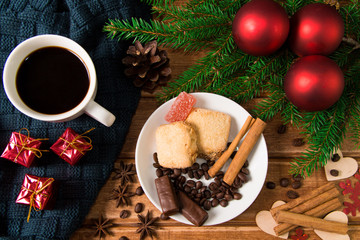 Cup of coffee with cookies on Christmas morning. Christmas decor. The view from the top.
