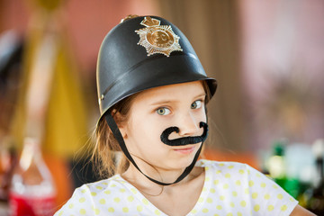 Cute teenage girl pretending a policeman