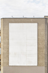White big empty billboard on the stucco wall