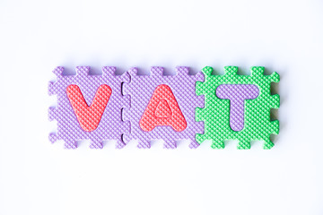 Color toy foam alphabet in word VAT (Abberviation of Value added tax) on white background