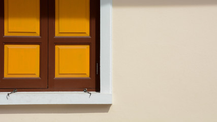 closed antique yellow wood window