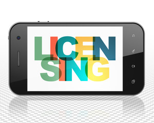 Law concept: Smartphone with Painted multicolor text Licensing on display, 3D rendering