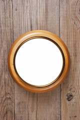 round wooden frame on a wooden wall