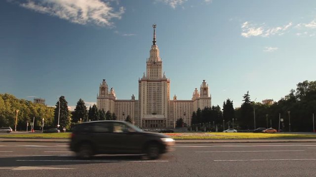 Car traffic in front of the building in the style of Stalin Architecture