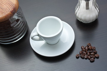 pile of coffee beans and a cup