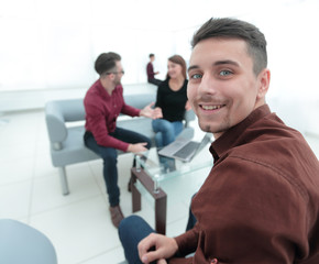 client on the background of the Bank's employees