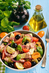 Potato salad with tuna, olives, capers, tomatoes and red onion.