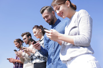 young people using smartphones to search network