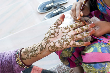 applying henna on hand, Hindu wedding ,Rajasthan, India