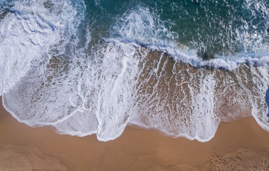 Fototapeta na wymiar Aerial view of a paradisiacal beach with waves