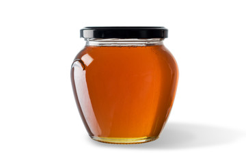 Honey in jar isolated on white background.