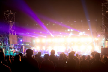 Fototapeta na wymiar Blurred background : Bokeh lighting in outdoor concert with cheering audience