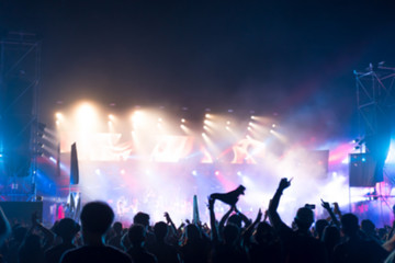 Fototapeta na wymiar Blurred background : Bokeh lighting in outdoor concert with cheering audience