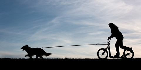 Woman and Dog Scootering
