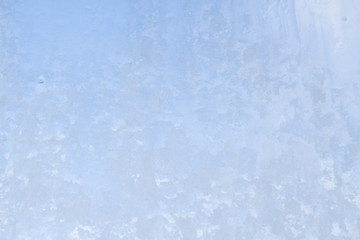 Winter frosty patterns on the frozen ice window