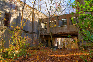 Abandoned building of the former restaurant on the top of Mount Akhun in sunny autumn day, Sochi, Russia
