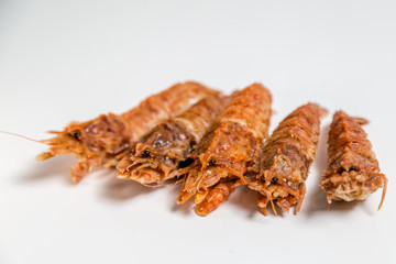 shrimp langoustine lie on a white background