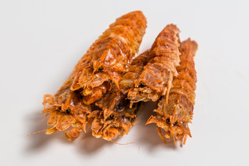 shrimp langoustine lie on a white background