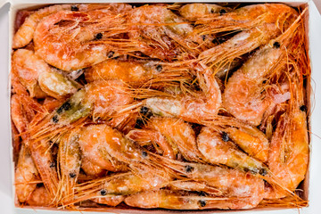 shrimp langoustine lie on a white background
