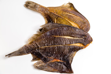 dried flounder lie on a white background