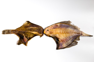Fototapeta premium dried flounder lie on a white background