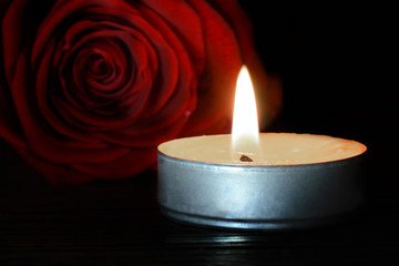 Funeral candle and flower. Condolence card.