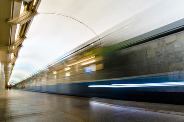 Subway metro train arriving at a station