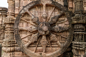 Intricate carvings on a stone wheel in the ancient  Hindu Sun Temple at Konark, Orissa, India.