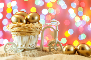 Easter card. Golden eggs in a Bicycle cart. Egg. happy Easter.
